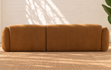 Load image into Gallery viewer, Hugh two-piece sectional sofa upholstered in textured camel brown chunky woven chenille with broad cushions and rounded arms.
