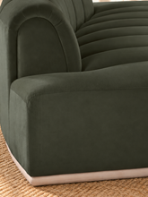 Load image into Gallery viewer, Jackie sofa in Olive Branch velvet with deep channel tufting, curved silhouette, and natural-finish rounded rubberwood base.
