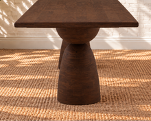 Load image into Gallery viewer, Jane warm brown mango wood dining table with rectangular rounded-edge top and two sculptural hourglass pedestal bases.
