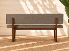 Load image into Gallery viewer, Jase ash grey upholstered dining bench with tufted backrest and walnut-finished geometric solid rubberwood legs.
