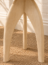 Load image into Gallery viewer, Jillian side table in sand-finished mango wood with an elongated oval tabletop, rounded edges, and sculptural tapered pedestal base.
