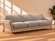 Load image into Gallery viewer, Image 2 of 5: Jules upholstered wooden sofa in Soft Ash with gray fabric, flared arms, contoured backrest, and solid Rubberwood frame
