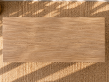 Load image into Gallery viewer, Kallie rectangular dining table in natural acacia wood with Brushed Smoke finish and sculptural intersecting panel base.
