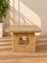 Load image into Gallery viewer, Kamari natural oak rectangular coffee table with rounded corners and two sculptural panel legs featuring circular cutouts.
