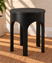 Load image into Gallery viewer, Kaylee sculptural side table in charcoal black with rounded top and arched openwork base.
