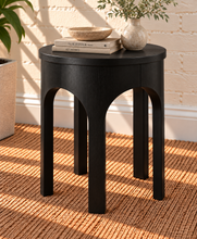 Load image into Gallery viewer, Kaylee sculptural side table in charcoal black with rounded top and arched openwork base.
