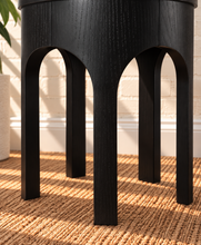 Load image into Gallery viewer, Kaylee sculptural side table in charcoal black with rounded top and arched openwork base.
