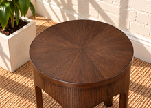 Load image into Gallery viewer, Kaylee sculptural side table in natural brown with a round top and arched Art Deco-inspired base.
