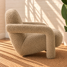 Load image into Gallery viewer, Kinsley latte beige textured upholstered accent chair with rounded back, cushioned seat and sculptural arms and legs.
