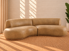 Load image into Gallery viewer, Image 1 of 5: Kirby 2-Piece curved sectional sofa in Saddle Tan vegan leather with rounded seating and curved Rubberwood base
