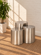 Load image into Gallery viewer, Klein three-piece Orbit nesting side tables in brushed chrome with rounded cylindrical forms.
