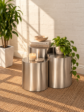 Load image into Gallery viewer, Klein three-piece Orbit nesting side tables in brushed chrome with rounded cylindrical forms.
