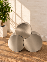 Load image into Gallery viewer, Klein three-piece Orbit nesting side tables in brushed chrome with rounded cylindrical forms.
