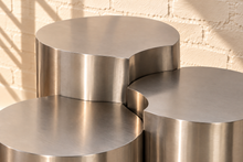 Load image into Gallery viewer, Klein three-piece Orbit nesting side tables in brushed chrome with rounded cylindrical forms.
