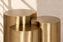 Load image into Gallery viewer, Klein three-piece Orbit nesting side tables in brushed gold with rounded cylindrical forms.
