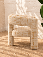 Load image into Gallery viewer, Kristine accent chair upholstered in textured cream and rust tweed with curved arms, open back details, and rounded cushioned seat.
