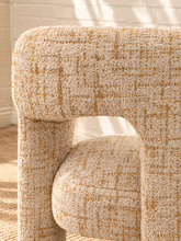 Load image into Gallery viewer, Kristine accent chair upholstered in textured cream and rust tweed with curved arms, open back details, and rounded cushioned seat.
