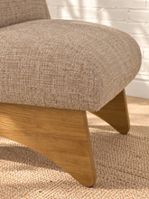 Load image into Gallery viewer, Kyro oat beige upholstered slipper chair with rounded tight back, cushioned seat and sculptural oak veneer wood legs.
