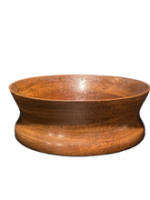 Load image into Gallery viewer, 1960s Danish Teak round wooden bowl with a wide rim and a flared base, made from medium brown wood with visible grain patterns, set against a dark textured background.
