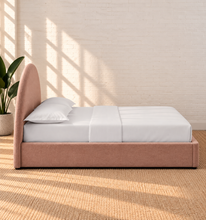 Load image into Gallery viewer, Laurane Queen Size platform bed in Blossom Pink with rounded arch headboard, upholstered frame, and lift-up underbed storage.
