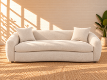 Load image into Gallery viewer, Image 1 of 5: Leighton upholstered sofa in Cloud Ivory fabric with rounded silhouette, sloped arms, broad bench seat, and black legs
