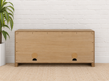 Load image into Gallery viewer, Levi three-door media cabinet in natural acacia wood with clean handle-free doors, visible wood grain and a low framed base.
