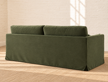 Load image into Gallery viewer, Liana olive linen-blend slipcovered sofa with deep bench cushion, two back cushions, and matching throw pillows
