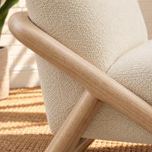 Load image into Gallery viewer, Lucia oatmeal textured lounge chair with rounded seat and back and sculptural curved natural wood sled frame
