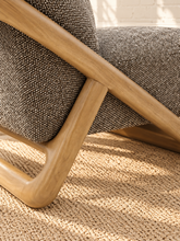 Load image into Gallery viewer, Lucia lounge chair with textured mocha upholstery, rounded seat and back, and sculptural curved natural wood sled frame
