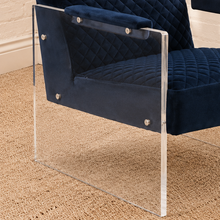 Load image into Gallery viewer, Lucian navy blue velvet accent chair with diamond-quilted upholstery, padded armrests and clear acrylic legs.
