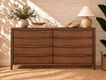Load image into Gallery viewer, Image 2 of 4: Luciana 8-Drawer Dresser in Natural Walnut with curved drawer pulls, rounded corners, and visible wood grain
