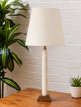 Load image into Gallery viewer, Image 3 of 6: Lumi Ivory Marble table lamp with off-white linen-textured shade, Walnut wood base, and brass detail
