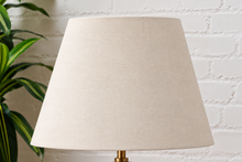 Load image into Gallery viewer, Image 4 of 6: Lumi Ivory Marble table lamp with off-white linen-textured shade, Walnut wood base, and brass detail
