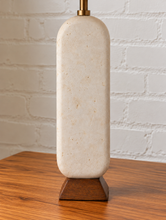 Load image into Gallery viewer, Image 5 of 6: Lumi Ivory Marble table lamp with off-white linen-textured shade, Walnut wood base, and brass detail
