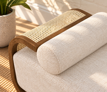 Load image into Gallery viewer, Lyca upholstered beige fabric chaise lounge with walnut-finish wood frame, natural synthetic cane, and curved Art Deco design

