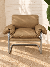 Load image into Gallery viewer, Mara tan vegan leather lounge chair with oversized cushions and polished chrome cantilever frame
