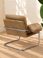 Load image into Gallery viewer, Mara tan vegan leather lounge chair with oversized cushions and polished chrome cantilever frame
