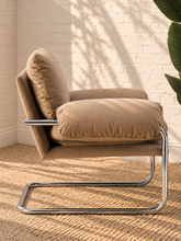 Load image into Gallery viewer, Mara camel velvet lounge chair with oversized padded cushions and polished chrome cantilever frame
