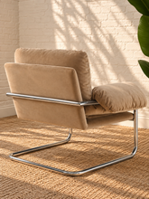 Load image into Gallery viewer, Mara camel velvet lounge chair with oversized padded cushions and polished chrome cantilever frame
