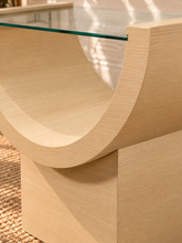Load image into Gallery viewer, Marcel Blonde Oak side table with curved oak veneer base and tempered glass top.
