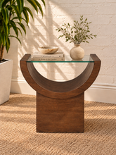 Load image into Gallery viewer, Marcel Natural Brown side table with curved oak veneer base and tempered glass top.
