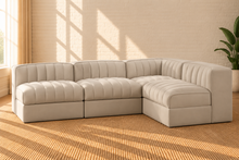 Load image into Gallery viewer, Maricon 4-piece modular sectional sofa in Ivory Beige velvet with deep channel tufting, rounded cushions, and contemporary L-shaped design.
