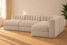 Load image into Gallery viewer, Maricon 4-piece modular sectional sofa in Ivory Beige velvet with deep channel tufting, rounded cushions, and contemporary L-shaped design.
