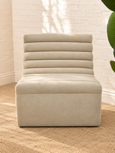 Load image into Gallery viewer, Marlowe lounge chair in bisque fleece with armless silhouette, deep seat, and rounded channel tufting across the seat and back
