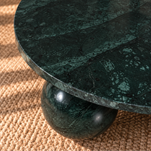 Load image into Gallery viewer, Martha round Forest Night marble coffee table with three spherical ball-shaped bases and natural dark green stone veining.
