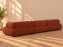 Load image into Gallery viewer, Image 3 of 4: Megan 3-Piece sectional sofa in Burnt Sienna chenille with bumper chaise configuration and rounded cushions
