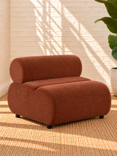 Load image into Gallery viewer, Image 1 of 4: Megan armless lounge chair in Burnt Sienna chenille with rounded upholstered silhouette and low black legs
