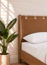 Load image into Gallery viewer, Meryll Queen-Size Bed in Toasted Camel vegan leather with Brown Walnut frame and Art Deco headboard
