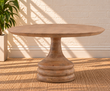 Load image into Gallery viewer, Micah natural mango wood round dining table with circular top and sculptural tapered pedestal base.
