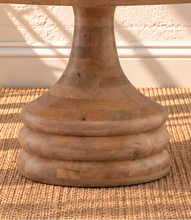 Load image into Gallery viewer, Micah natural mango wood round dining table with circular top and sculptural tapered pedestal base.
